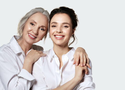 Photo of a happy older woman and younger woman